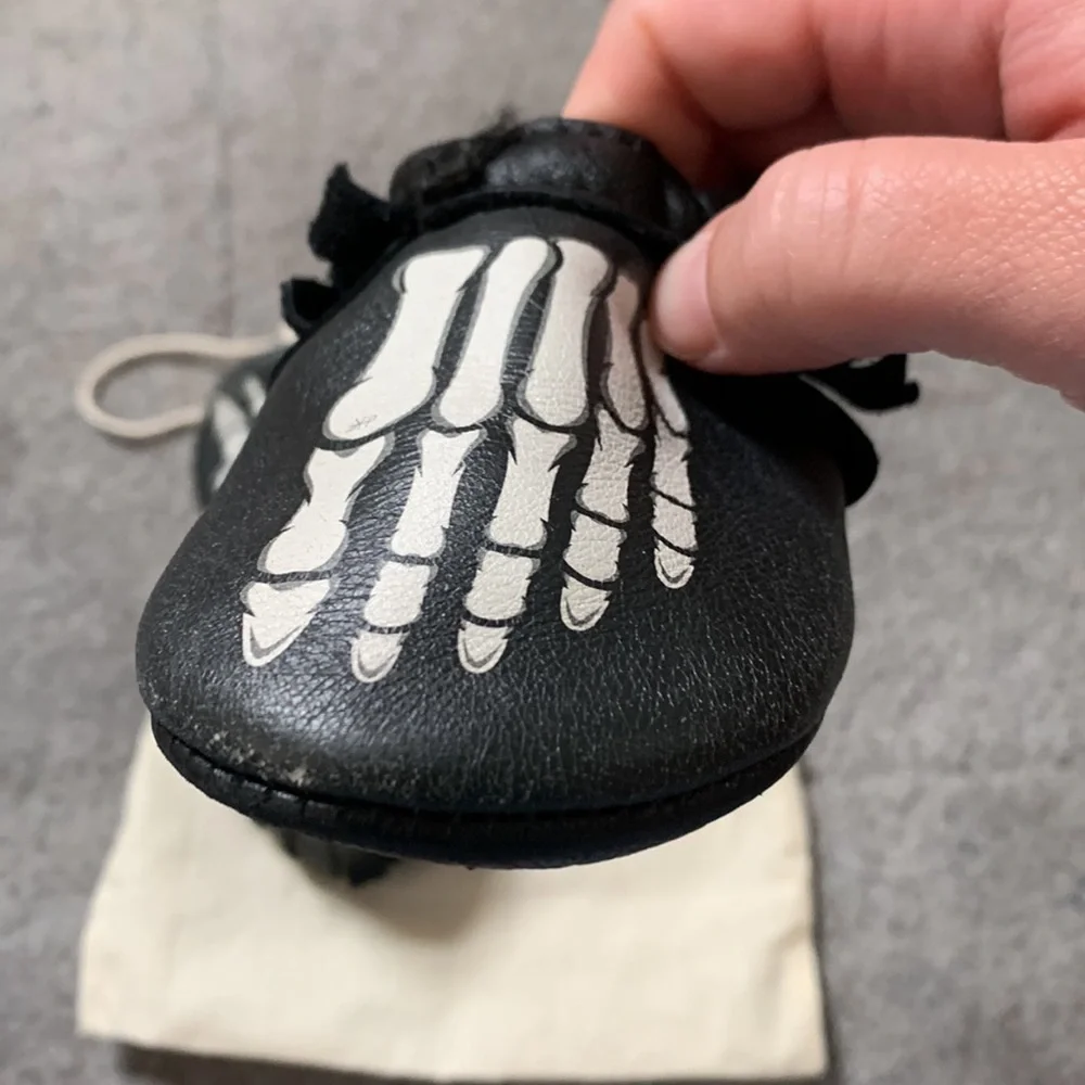 Freshly Picked Black Moccasins with White Skeleton Print